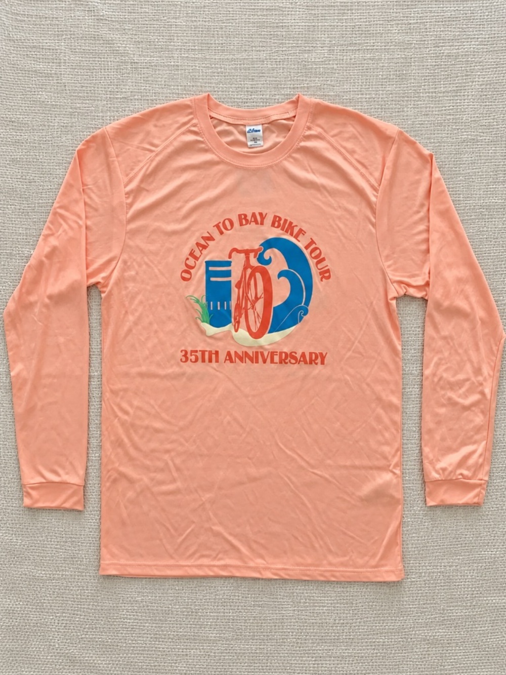 2024 Ocean to Bay Bike Tour 35th Anniversary Coral UPF 50 Shirt M